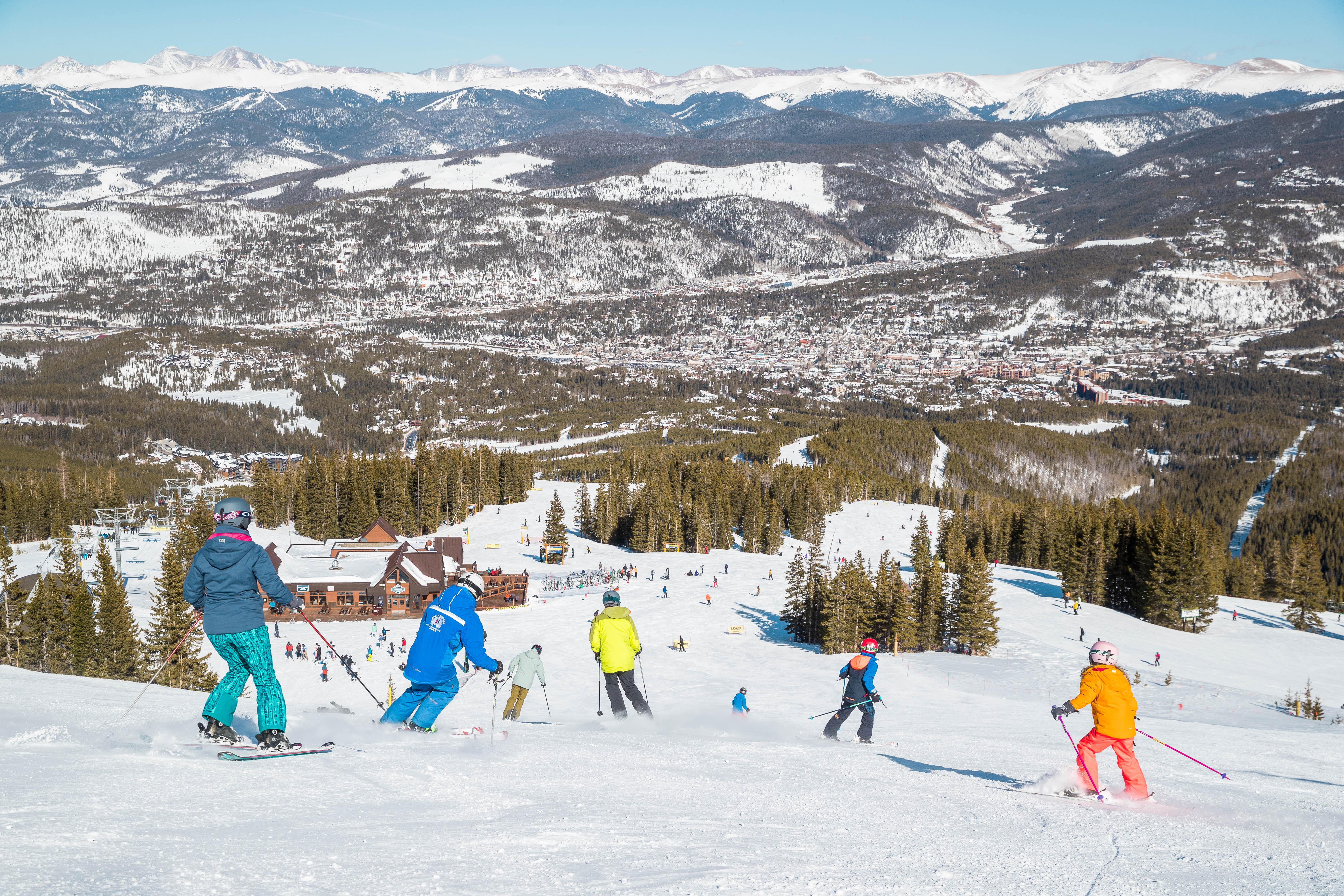 A family skies into Vista Haus with instructor at Breckenridge  